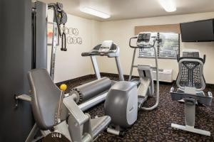 a gym with cardio equipment in a room at Baymont by Wyndham Glenwood in Glenwood