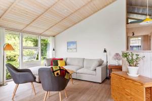 a living room with a couch and a table at 1497-N-Gilleleje-Parcelvej-3 in Gilleleje