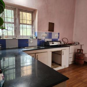 a kitchen with a sink and a counter top at Lakeview Meadows in Vagamon