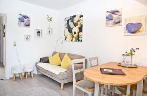 a living room with a couch and a table at Steinhauser`s Ferienwohnungen in Augsburg