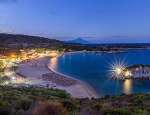 an aerial view of a beach at night at Eden's Garden Kalamitsi in Kalamitsi