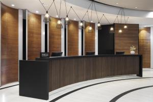 a lobby with wood paneling and a reception desk at Doubletree by Hilton Ljubljana in Ljubljana