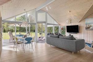 a living room with a couch and a table at 1572-Melby-Kildegardsvej-10 in Melby