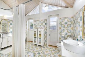 a bathroom with a sink and a toilet at 1517-Melby-Lindebjergvej-78 in Melby +13 photos