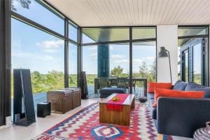 a living room with a couch and a coffee table at 1164-N-Melby-Bjergvej-7 in Melby
