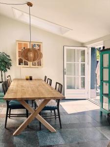 a dining room with a wooden table and chairs at 1645-Graested-Udsholt-Strandvej-101 in Græsted