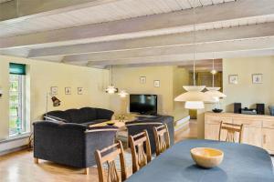 a living room with a couch and a table at 10820-Ulfborg-Baekbyvej-113 in Ulfborg