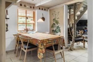 a dining room with a table and chairs at 10439-Ulfborg-Gaffelbjergvej-60 in Ulfborg