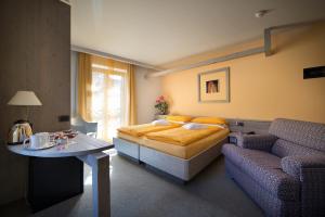 Postel nebo postele na pokoji v ubytování Hotel Marzia