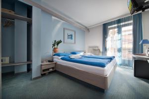 Postel nebo postele na pokoji v ubytování Hotel Marzia