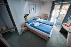 Postel nebo postele na pokoji v ubytování Hotel Marzia