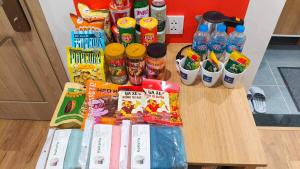 a table with some snacks and drinks on it at LokoOne Central Hub in Hòa Bình