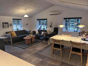 a living room with a couch and a table at 30859-Ulfborg-Bellisvej-432 in Ulfborg