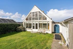 a large white house with a lawn in front of it at 70303-Ulfborg-Jagtvejen-4 in Ulfborg