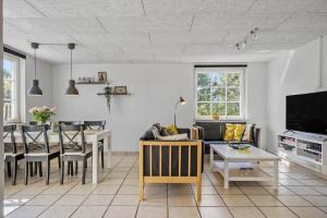 a living room with a couch and a table at 30876-Ulfborg-Krogsgardvej-5 in Ulfborg