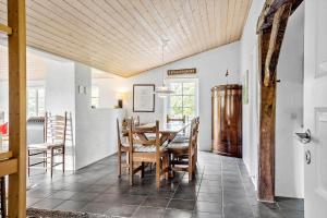a dining room with a table and chairs at 10706-Ulfborg-Graevlingevej-3 in Ulfborg
