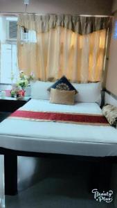 a bed in a room with at New Fortunate Guest House in Hong Kong +13 photos