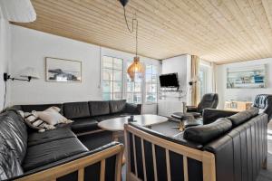 a living room with a couch and a table at 51401-Ulfborg-Sdr-Fjandvej-46 in Ulfborg