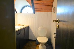 a bathroom with a toilet and a sink at 20039-Ulfborg-Sortebaervej-8 in Ulfborg +19 photos