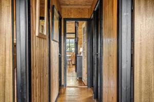 a hallway of a house with wooden walls and wooden floors at 20039-Ulfborg-Sortebaervej-8 in Ulfborg