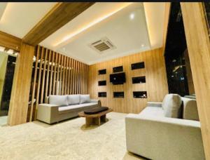 a living room with a couch and a table at Hotel Sunny Jhalawar in Jhālāwār
