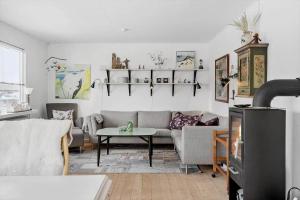 a living room with a couch and a table at 70268-Ulfborg-Vesterhavsgade-16 in Ulfborg