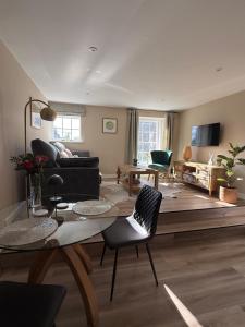 a living room with a table and a couch at Townhouse in Shaftesbury