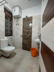a bathroom with a toilet and a sink and a shower at Hotel white lion-Near Bhajra Taxi Stand in Gangtok