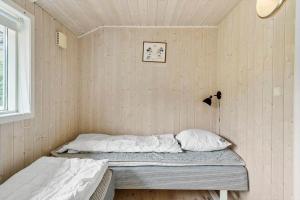 a bedroom with two beds in a room at 80608-Vemb-Knudehus-51 in Vemb