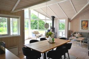 a dining room with a wooden table and chairs at 80608-Vemb-Knudehus-51 in Vemb