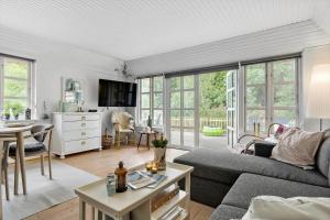 a living room with a couch and a table at 10173-Ulfborg-Gaffelbjergvej-24 in Ulfborg