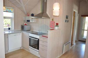 a kitchen with white cabinets and a stove at 30070-Ulfborg-Klovervej-478 in Ulfborg