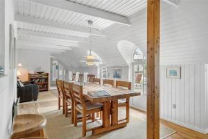 a dining room with a table and chairs at 10616-Ulfborg-Vester-Mosevej-28 in Ulfborg