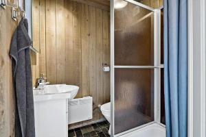 a bathroom with a toilet and a sink and a shower at 80182-Vemb-Ogelstrupvej-4 in Vemb +36 photos