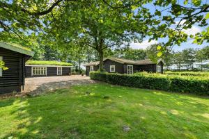 an image of a house with a yard at 80182-Vemb-Ogelstrupvej-4 in Vemb