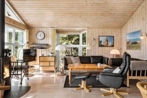 a living room with a couch and a table at 30872-Ulfborg-Bellisvej-514 in Ulfborg