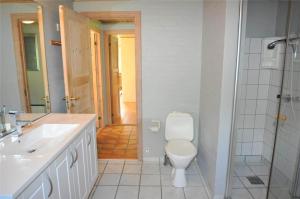 a bathroom with a toilet and a sink and a shower at 10718-Ulfborg-Baekbyvej-117 in Ulfborg +15 photos