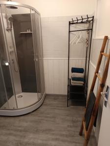 a shower with a glass door in a bathroom at La Céret'nitude in Céret +14 photos