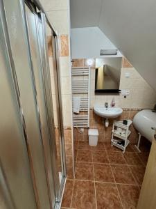 a small bathroom with a sink and a toilet at Chata Boubín in Kubova Huť +68 photos
