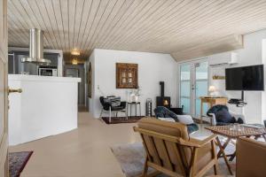 a living room with a couch and a table at 10611-Ulfborg-Gaffelbjergvej-6 in Ulfborg