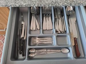 a tray filled with utensils and utensils at Torre Plaza 5 in Boiro +25 photos