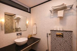 a bathroom with a sink and a mirror at Harnawa Haveli - A Boutique Heritage Stay in Jaipur in Jaipur +22 photos