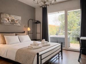 a bedroom with a bed with towels on it at Cameracaffè sul Lago in Arezzo +26 photos