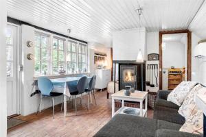 a living room with a couch and a table at 30327-Ulfborg-Grastensborgvej-38 in Ulfborg