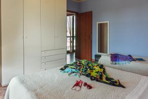 Postel nebo postele na pokoji v ubytování Villetta Dino