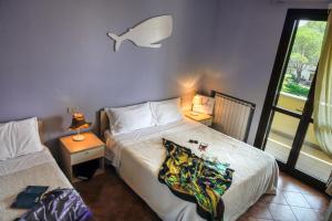 Postel nebo postele na pokoji v ubytování Villetta Dino