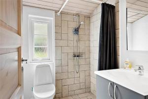 a bathroom with a shower and a toilet and a sink at 10878-Ulfborg-Graemvej-31 in Ulfborg +18 photos