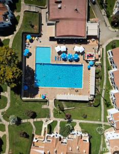 an overhead view of a swimming pool in a resort at Apartment for 6 with a private terrace in Son Bou in Son Bou