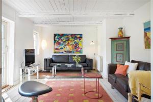 a living room with a couch and a tv at 20033-Ulfborg-Vesterhavsvej-15 in Ulfborg