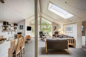 a living room with a couch and a table at 30705-Ulfborg-Valmuevej-288 in Ulfborg